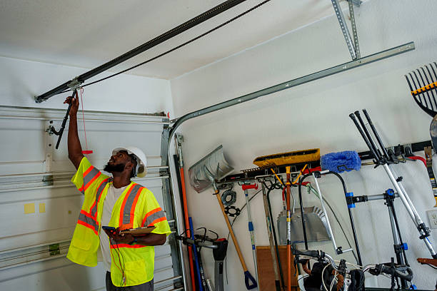 Professional Garage Door Spring Repair technician working in Stewart Manor, NY